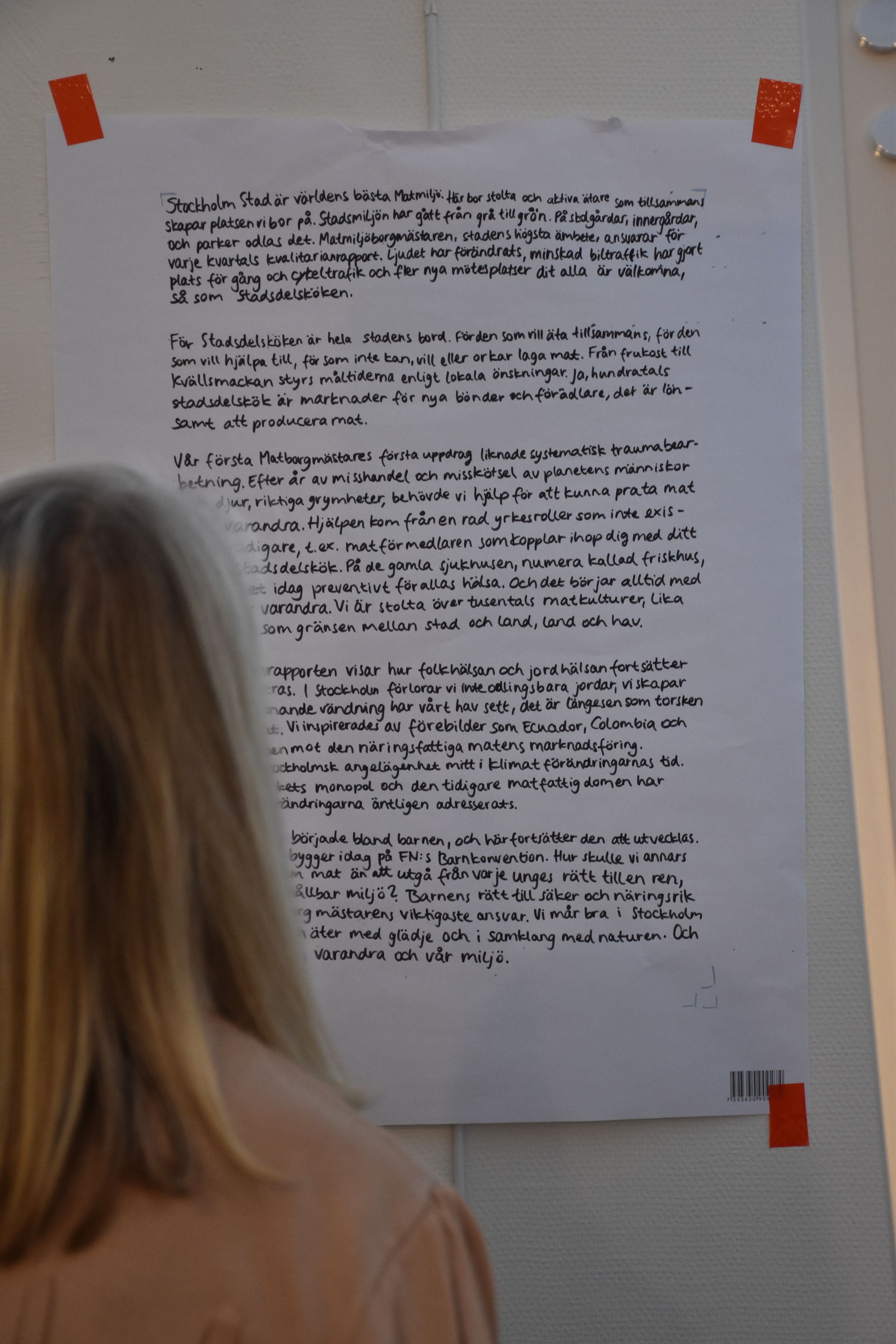 Person reading a poster at assembly 3
