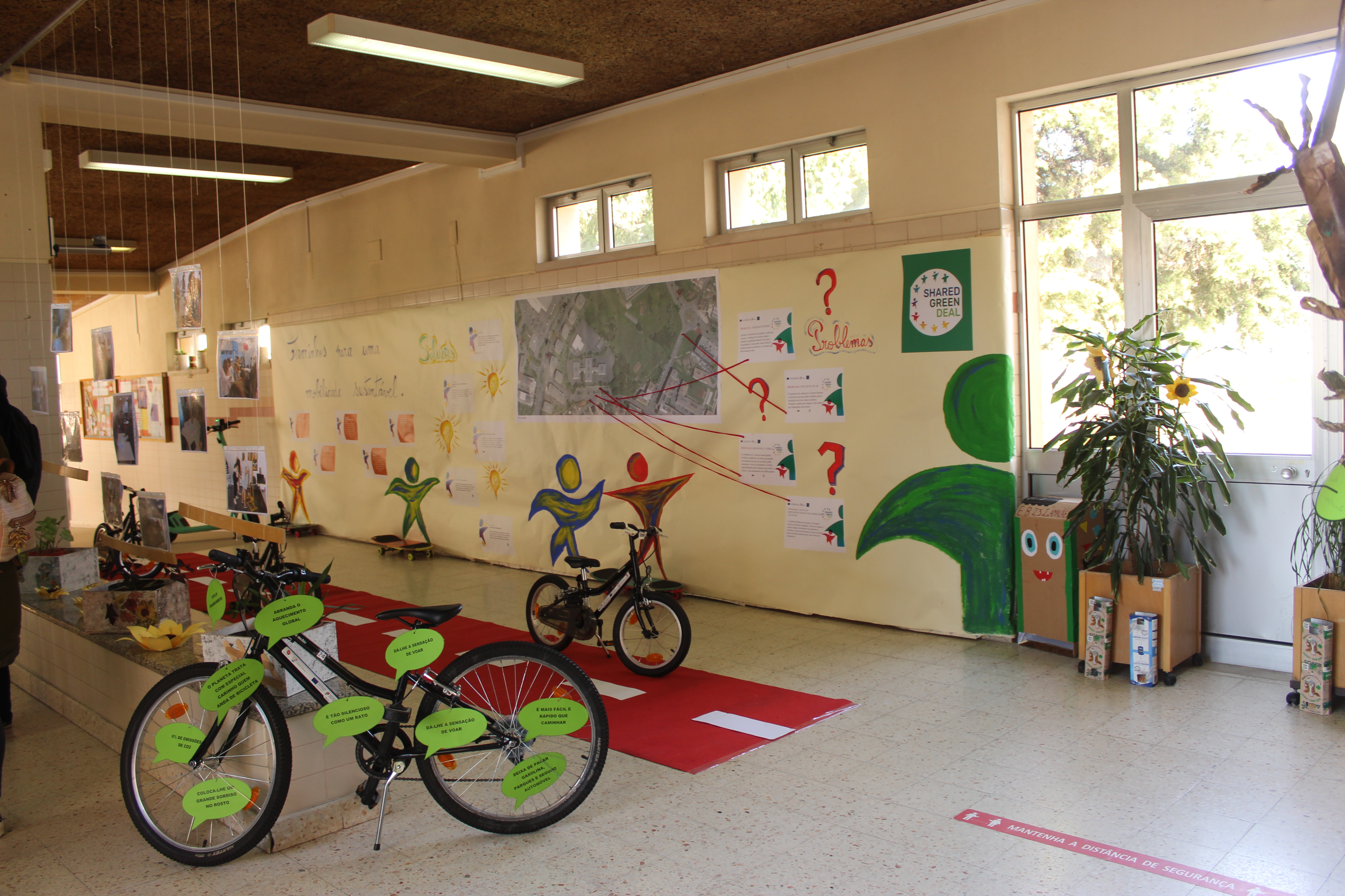 a display of bikes, posters and more alluding to active mobility