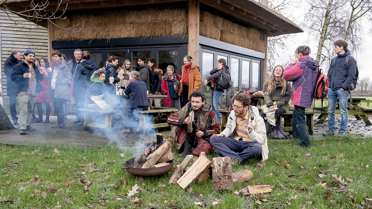 People sitting by a fire