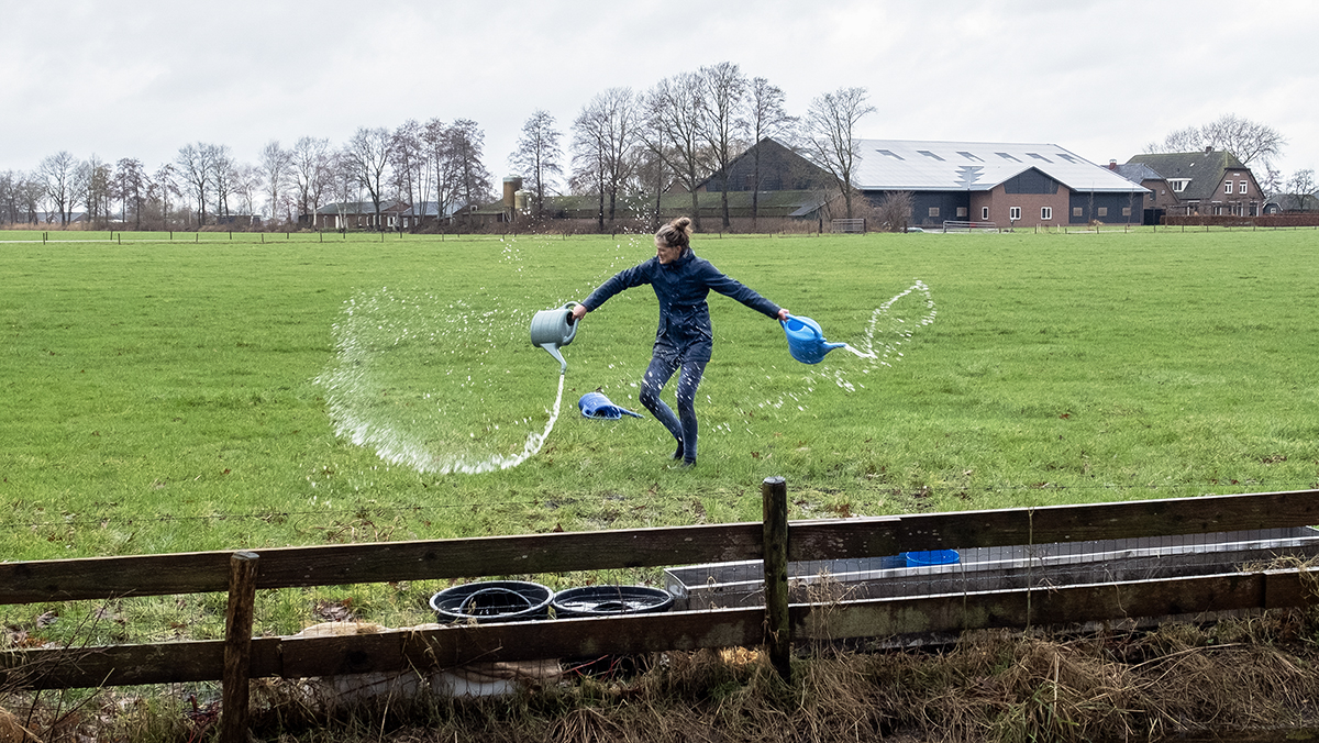 Woman with watering cans