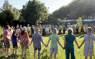 Participants forming a big circle