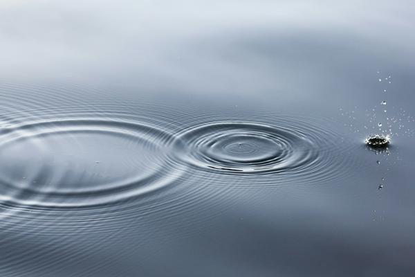 A photo of some drops in water