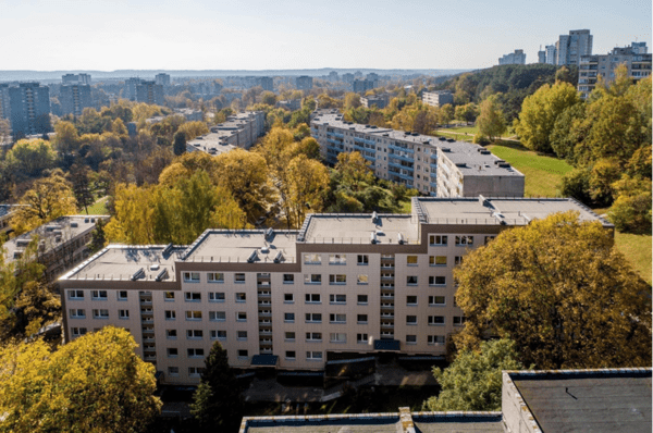A building lock surrounded by green buildings